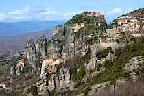 Four Greek Orthodox Rock Monasteries  in Meteora. The Holy Monastery of Rousanou/St. Barbara (foreground right) founded in the mid 16th century, in the background the Holy Monastery of St. Nicholas An...