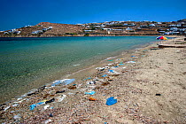 Plastic trash litters on beach, Mykonos island, Cyclades, Aegean Sea, Mediterranean, Greece, August 2007.