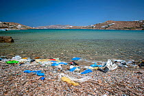 Plastic litter on beach, Mykonos town. Mykonos island, Cyclades, Aegean Sea, Mediterranean, Greece, August 2007.