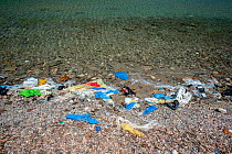 Plastic litter on beach.Mykonos island, Cyclades, Aegean Sea, Mediterranean, Greece, August 2007.