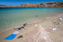 Plastic litter on a beach near Mykonos town. Mykonos island, Cyclades, Aegean Sea, Mediterranean, Greece, August 2007.