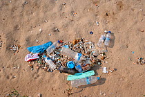 Plastic trash littering a beach near Mykonos town, Mykonos island, Cyclades, Aegean Sea, Mediterranean, Greece, August 2007.