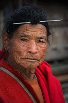 Apatani man with traditional hair knot fixed by a skewer or Piidin Khotu. Apatani Tribe, Ziro Valley, Himalayan Foothills, Arunachal Pradesh.North East India, November 2014.