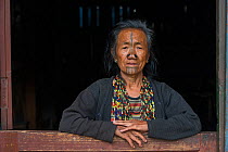 Apatani woman with facial tattoos and traditional cane nose plugs / Yapin Hulo made to make them look unattractive to males from other tribes. These facial modifications are  now  outlawed. Apatani Tr...