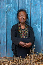 Apatani woman with facial tattoos and traditional cane nose plugs / Yapin Hulo made to make them look unattractive to males from other tribes. These facial modifications are  now  outlawed. Apatani Tr...