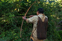 Adi Gallong man with bow and arrow. Adi Gallong Tribe. Arunachal Pradesh, North East India, October 2014.