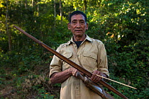 Adi Gallong man with bow and arrow. Adi Gallong Tribe. Arunachal Pradesh, North East India, October 2014.