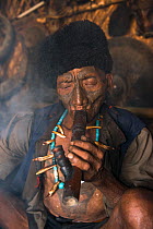 Konyak Naga opium smokers. Mon district. Nagaland,  North East India, October 2014.