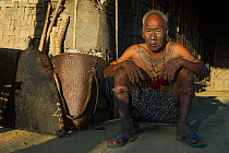 Konyak Naga tattooed head hunter. Only someone who has killed and taken a human head can be tattooed in this manner. Mon district. Nagaland,  North East India, October 2014.