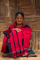 Chang Naga woman in  traditional shawl, Tuensang district. Nagaland, North East India, October 2014.