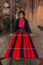 Chang Naga woman weaving, Tuensang district. Nagaland, North East India, October 2014.