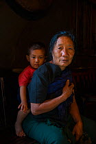 Ao Naga woman with child. Mokokchung district. Nagaland, North East India, October 2014.