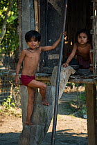 Mising child at home,  Majuli Island, Assam, North East India, October 2014.