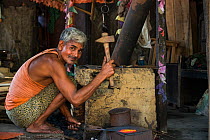 Assamese blacksmith. Assam. North East India, October 2014.
