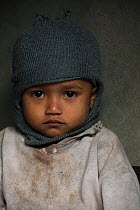 Khasi Child wearing woolly hat, Nongriat, Khasi Hills. Meghalaya, North East India, October 2014.