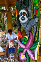 Painted mask artwork created by Boruca man showing sloth, indigenous people, Costa Rica. December 2014.