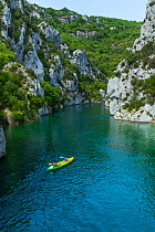 Kayakers in Quinson Lake, Gorges du Verdon Natural Park, Alpes Haute Provence, France, July 2015.