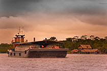 Amazon Gas tanker on the Rio Nanay at dusk, where it joins the Amazon, Iquitos, Peru, October 2014.