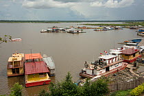 Floating petrol stations on the confluence of the River Itaya and River Amazon, Iquitos, Peru, November 2014.