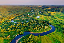 Aerial view of Rver Koiva, and the border between Estonia and Latvia in Southern Estonia, Valgamaa, Estonia. August 2014. Estonia is on the left side of the river and Latvia on the right bank.