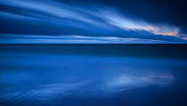 Long exposure of the blue water of the Baltic Sea, and clouds, Saaremaa Island, Estonia, December 2014.