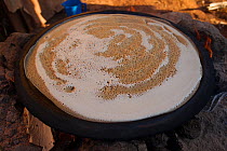 Cooking Injera bread, made with batter from fermented cereals. Jimba, Bahir Dar. Lake Tana Biosphere Reserve, Ethiopia.