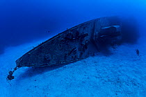 Diver explores the bow section of the 330ft long Russian frigate 356, the 'MV Keith Tibbetts', where rope sponges are growing. The ship was build in 1984 and sunk in 1996. Buccaneer Reef, Cayman Brac,...