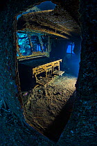 View through the door into the galley of the Chrisoula K wreck (also known as the tile wreck), showing the cooker. Abu Nuhas, Egypt. Strait of Gubal, Gulf of Suez, Red Sea. June.