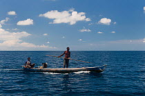 Moluccan fishermen  in their dugout canoe during traditional Leatherback turtle hunt (Dermochelys coriacea) Kei Kecil Island, Moluccas, Indonesia.