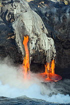 Red hot lava from Kilauea Volcano flowing into ocean at Puna, Big Island, Hawaiian Islands, USA, January 2013.