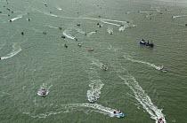 Large number of fishing boats fishing for Sockeye salmon (Oncorhynchus nerka) using drift gill nets, and trying to out  manoeuvre other boats.  Naknek River, Bristol Bay, Alaska, USA, July.