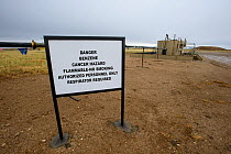 Hazard sign in Jonah field, a coalbed methane extraction site, near Pinedale, Wyoming, USA. May 2012.