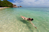 Woman swimming in Tanote Bay, Koh Tao Gulf, Thailand, October 2013. Model released.