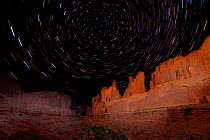Park Avenue rock formation under night sky with star trails, Arches National Park, Utah, USA, September 2009.