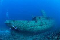 Scuba diver and Virgen de Altagracia wreck, Santa Lucia, Camaguey, Cuba, Caribbean Sea, Atlantic Ocean