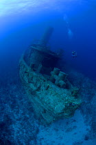 Scuba diver and Virgen de Altagracia wreck, Santa Lucia, Camaguey, Cuba, Caribbean Sea, Atlantic Ocean