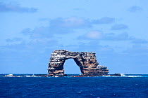 Darwin's Arch, a dramatic 50-foot tall natural lava arch,  offshore of Darwin Island, Galapagos Islands, East Pacific Ocean