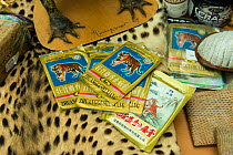 Tiger bone products used in Chinese medicine and other confiscated items in display of confiscated CITES protected wildlife products at Dusseldorf Airport, Germany, June 2015. Products seized by  Germ...