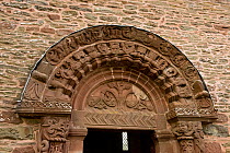 12th Century stone carved tympanum featuring the tree of life, also showing Green Man figure carved on the right capital, Herefordshire School of Romanesque Sculpture, Kilpeck Church, Herefordshire, E...