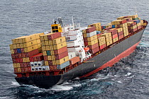 Container ship, MV Rena, approximately 14 hours after becoming grounded on Astrolabe Reef, off of the Port of Tauranga, Bay of Plenty, New Zealand, October 2011.