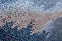 Oil slick and sheen on the sea surface, two days after the container ship MV Rena became grounded on Astrolabe Reef, off of the Port of Tauranga, Bay of Plenty, New Zealand, October 2011.