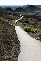 Paved section of the North Crater Trail in Craters Of The Moon National Monument and Preserve, Idaho, USA, June 2015.