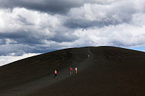 Tourists walking down from Inferno Cone, Craters Of The Moon National Monument, Idaho, USA, July 2015.