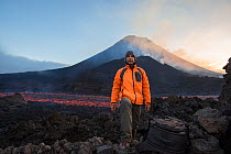 Photographer Pedro Narra standing in front of Fogo Volcano after eruption, Fogo Island, Cape Verde, 29th November 2014.