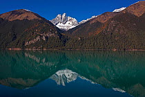 Mountains reflected in Lake Basongcuo / Pagsum Lake, Basongcuo National Park, Qinghai-Tibet Plateau, Tibet,   November 2011.