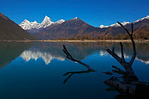 Mountains reflected in  Lake Basongcuo / Pagsum Lake, Basongcuo National Park, Qinghai-Tibet Plateau, Tibet,    November 2011.