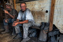 Two Charcoal burners in a shack having a break from work, Transylvania, Romania, June 2015.