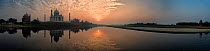 Panoramic of the Taj Mahal, reflected in the Yanuna river at sunset,  Agra, India. Digital composite panorama.