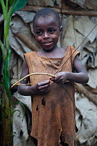 Baka child playing with bow and arrow, South East Cameroon, July 2008.