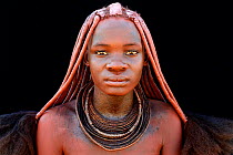 Portrait of Himba woman with the traditional jewellery and hair, Kaokoland, Namibia October 2015